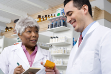 Woman and man working in a pharmacy