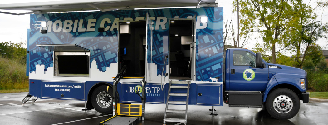 Photo of job seekers visiting the Mobile Career Lab (open view)